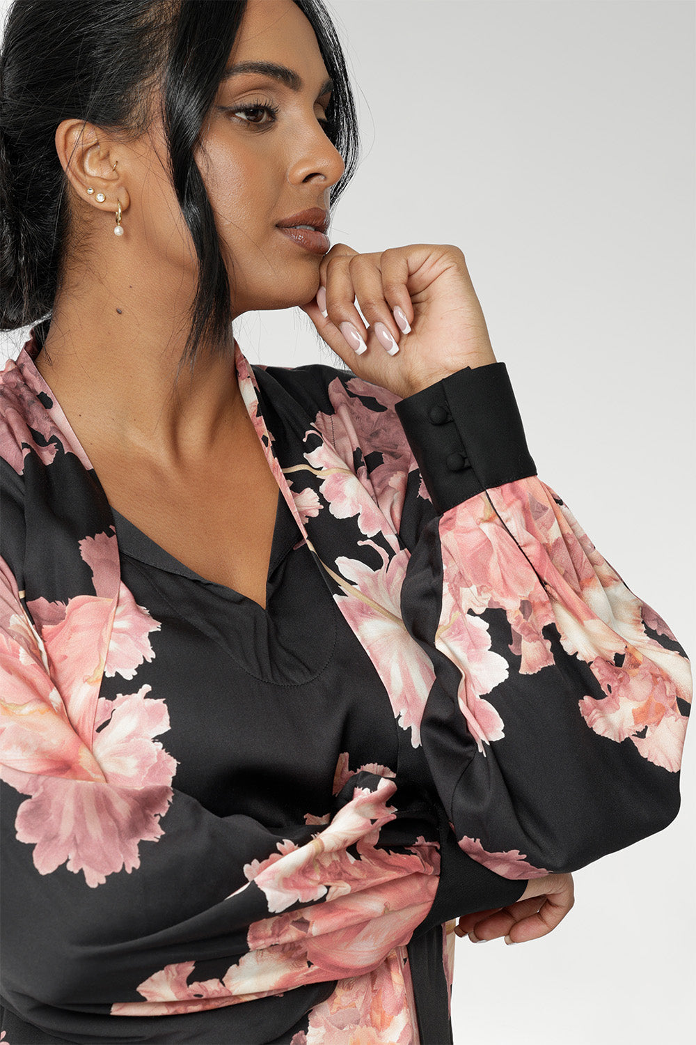 The Matisse Shirt brings timeless romance to your wardrobe. Size 10 woman wears floral blouse tucked into her straight leg pants.