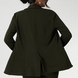 Back view image of Olive Merit blazer made from Scuba crepe, easy care fabric. With functional patch pockets and tailored shawl collar, you will look stylish in all corporate and casual occasions. Woman's workwear clothing made in Australia sizes 8-24.