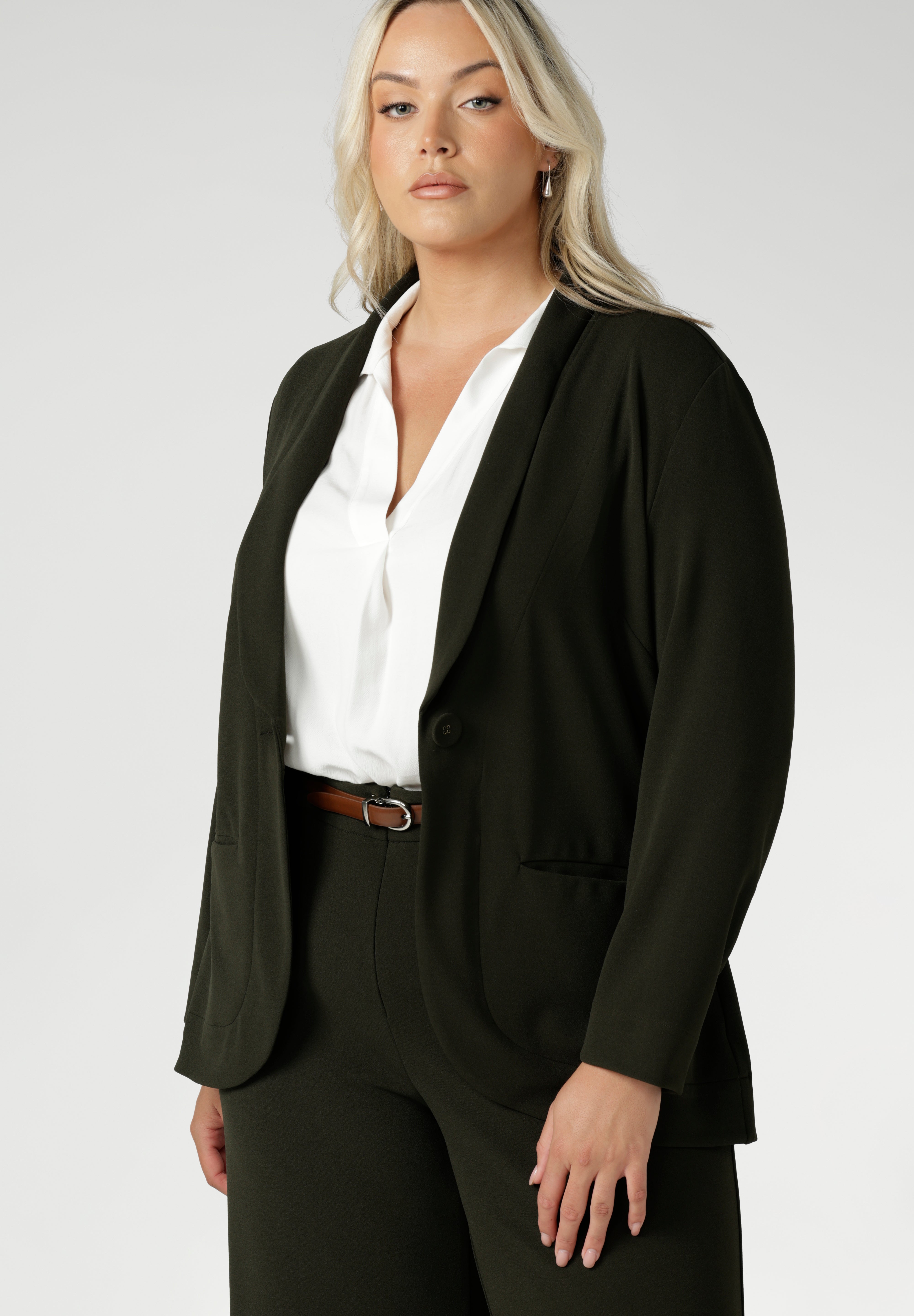 Womans plus size friendly blazer is made from easy care Scuba crepe jersey fabric. Crafted with functional patch pockets, tailored shawl collar and covered front button. Woman's blazer will have you looking stylish in all corporate and casual occasions. Woman's workwear clothing made in Australia sizes 8-24.