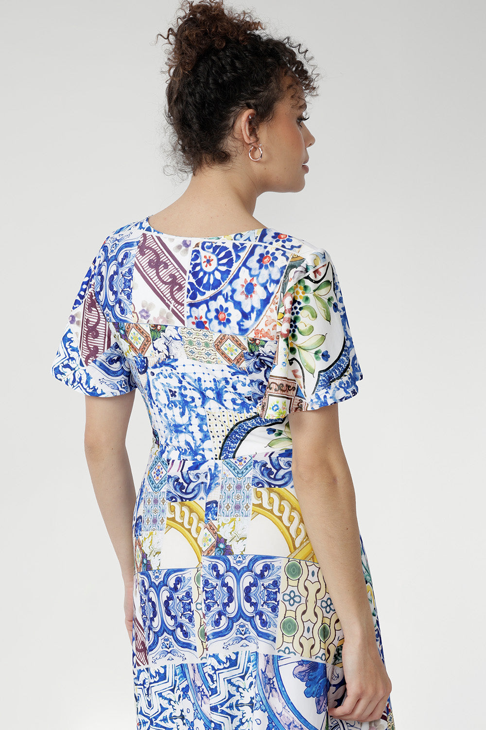 Meet the Mica Maxi Dress in Mosaic Tile—a stunning Australian-made jersey maxi dress designed for style and comfort. Crafted from our soft-touch stretch jersey with a smooth satin finish, it showcases a vibrant mosaic print inspired by Sicilian tilework.