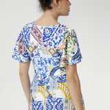 Meet the Mica Maxi Dress in Mosaic Tile—a stunning Australian-made jersey maxi dress designed for style and comfort. Crafted from our soft-touch stretch jersey with a smooth satin finish, it showcases a vibrant mosaic print inspired by Sicilian tilework.
