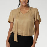 The Michael Shirt in Gold is the epitome of chic, elevated style, designed to seamlessly transition from professional workwear to elegant evening wear. Evening blouse has gold coloured fabric, that provides beautiful drape and a soft touch on the skin. Available in 2 colours in size 8-24.