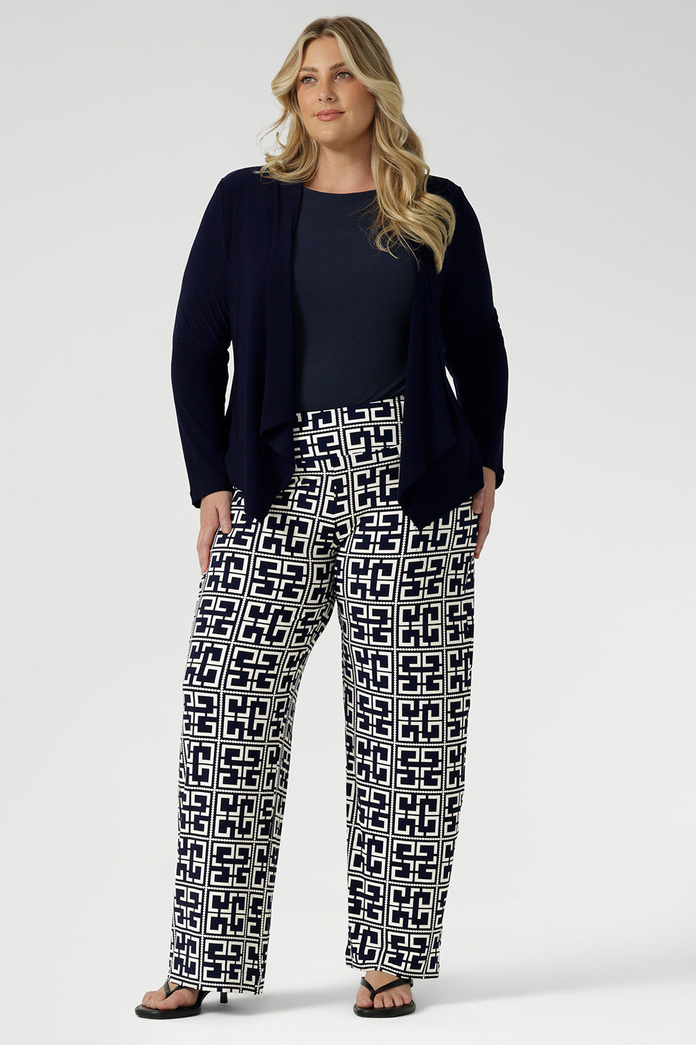 Softly tailored with a refined waterfall collar and an open front design, Mikey offers a polished, jacket-like silhouette that effortlessly carries you from the workday into evening events.