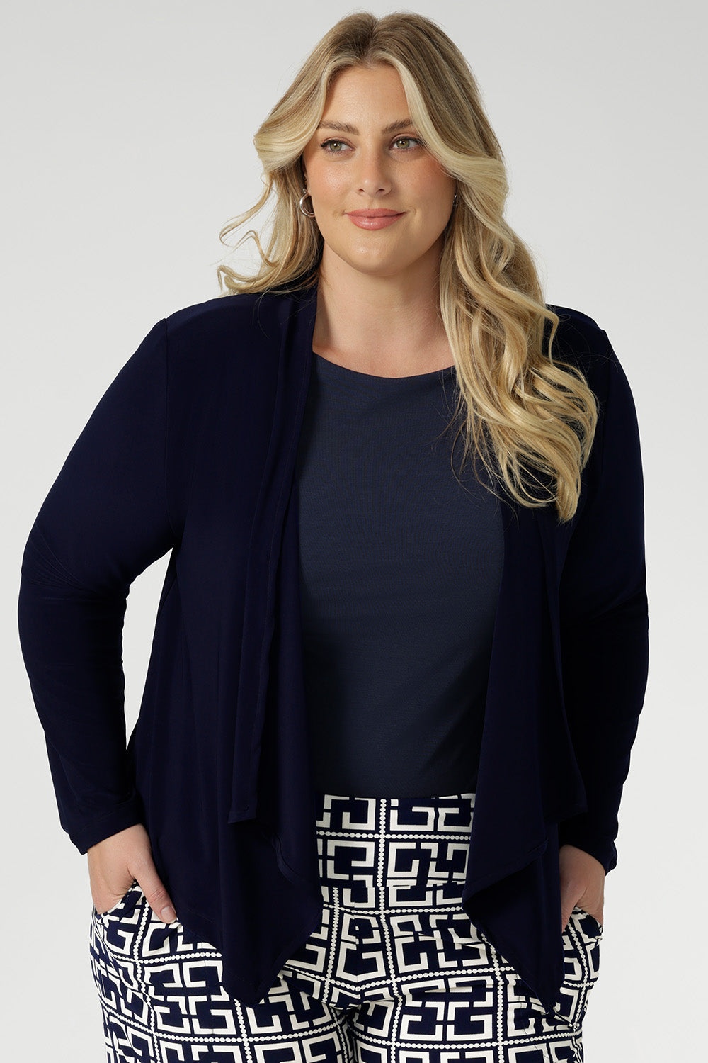 Designed with an open waterfall front and softly tailored for a jacket-like look, Mikey brings effortless sophistication to any outfit, taking you seamlessly from the office to after-hours occasions.