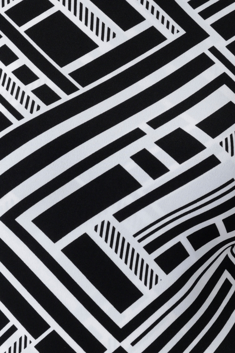 The Moderno print showcases a bold black and white geometric design, brought to life across a curated collection of women’s dresses, tops, and jumpsuits. Perfect for spring racing events, elevated workwear, or effortlessly stylish everyday dressing, each piece is crafted from a premium dry-touch jersey with soft stretch for all-day comfort. Proudly made in Australia by women, for women, the Moderno collection is available in inclusive sizing from 8 to 24.