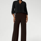 The Monroe Pant is made from a heavyweight dry-touch jersey fabric with a soft stretch. It features a pull-on design and is available in three lengths. The pant includes a deep, double-layer waistband, side pockets with topstitching detail, a straight-leg cut, and a deep hem for added structure.