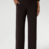 The pant includes a deep, double-layer waistband, side pockets with topstitching detail, a straight-leg cut, and a deep hem for added structure. Available in 3 lengths and in sizes 8-24.