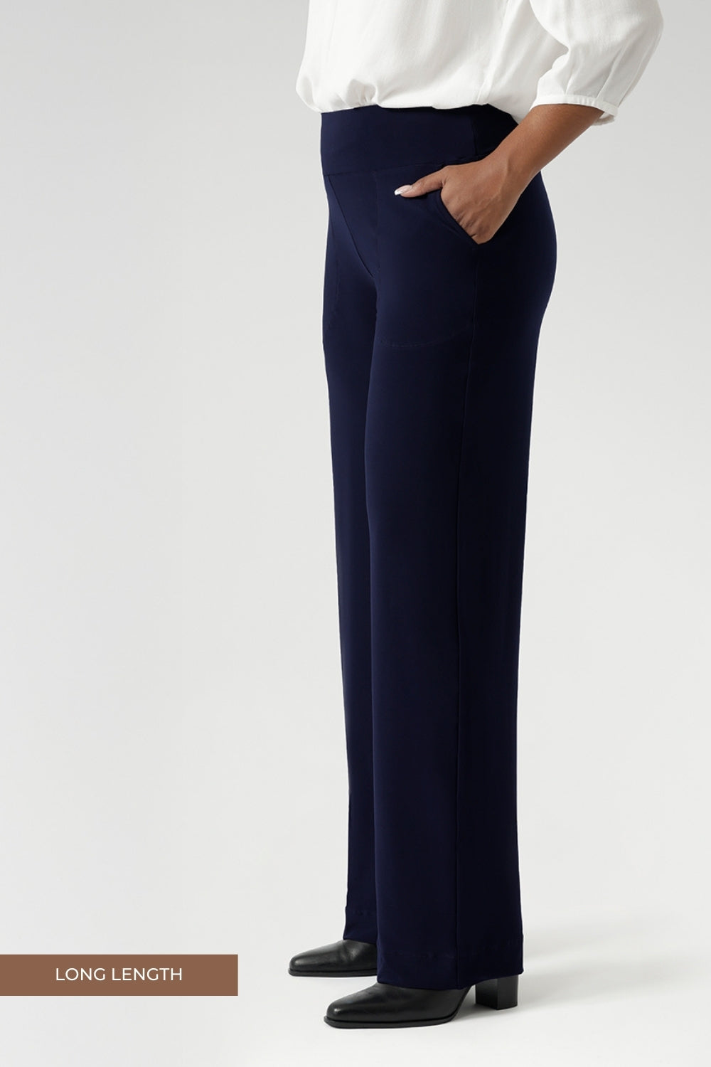 Women's size inclusive work pants. Comfortable navy corporate pants are full length, straight leg pants with stretch. Now available in sizes 8-24 and in 3 lengths. Over 30s woman wears the Monroe Pants Navy in the long length.