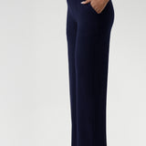 Women's size inclusive work pants. Comfortable navy corporate pants are full length, straight leg pants with stretch. Now available in sizes 8-24 and in 3 lengths. Over 30s woman wears the Monroe Pants Navy in the long length.