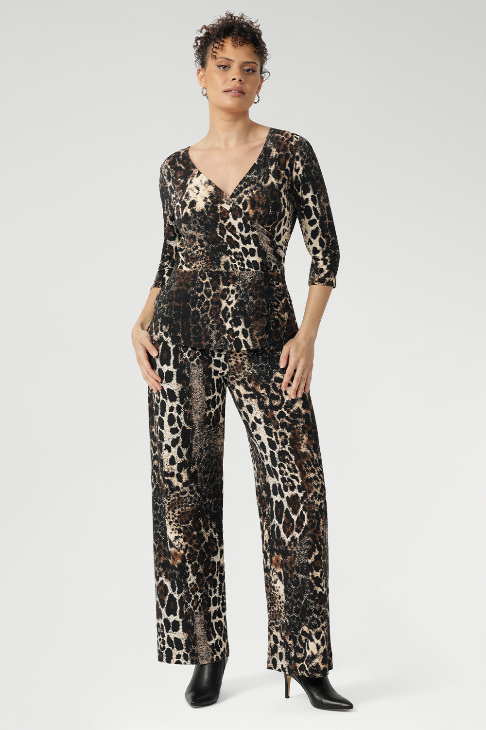 Style our best-selling Monroe Pant with matching Kyle or Bowie top for an easy, coordinated faux jumpsuit look. Over 30's woman wears her animal print jumpsuit.