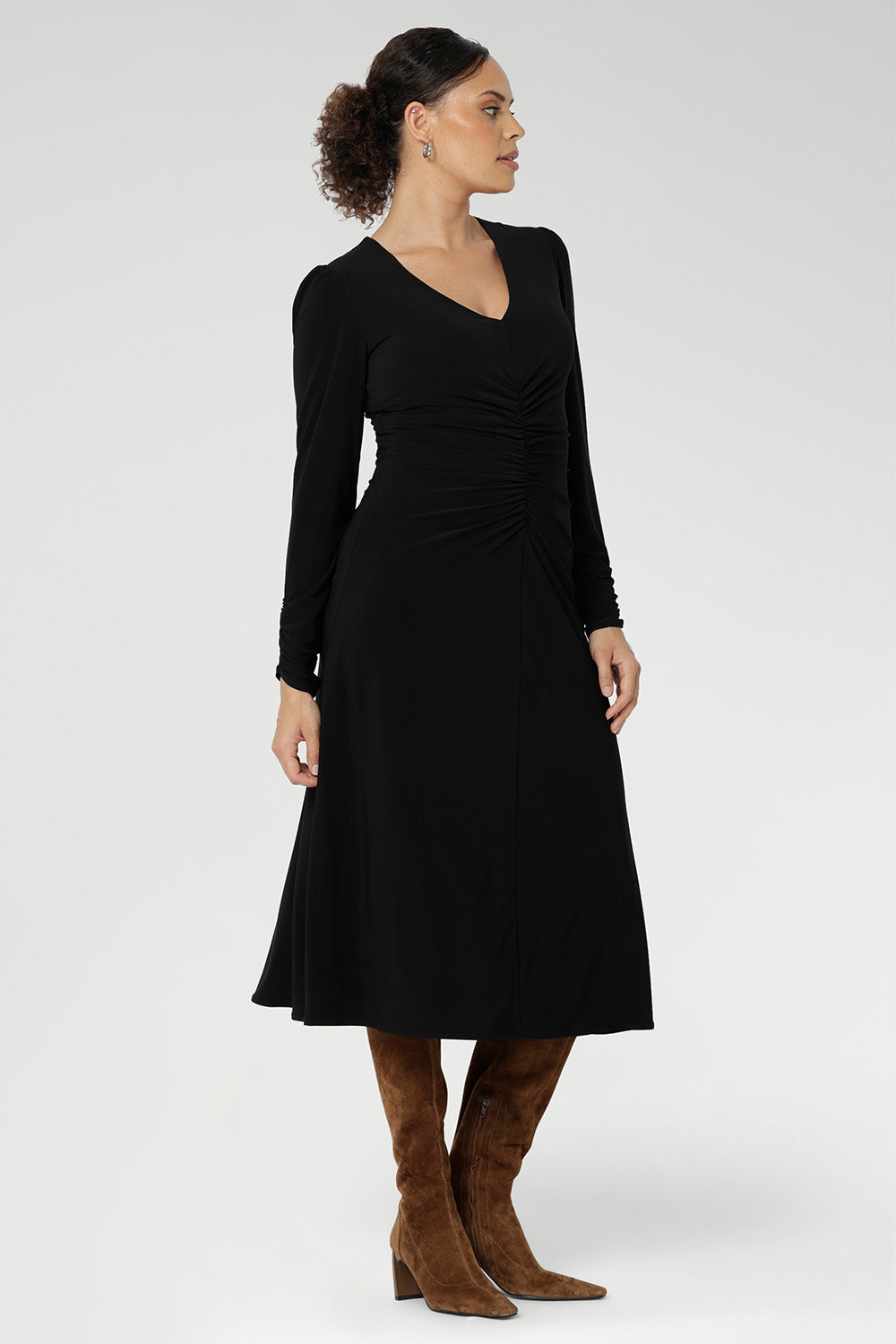 The Nadine Dress is a sophisticated staple, proudly designed and made in Australia from our signature black dry-touch stretch jersey. This timeless piece features a soft A-line silhouette that enhances the figure, while ruched sleeves add a modern, fashion-forward detail.