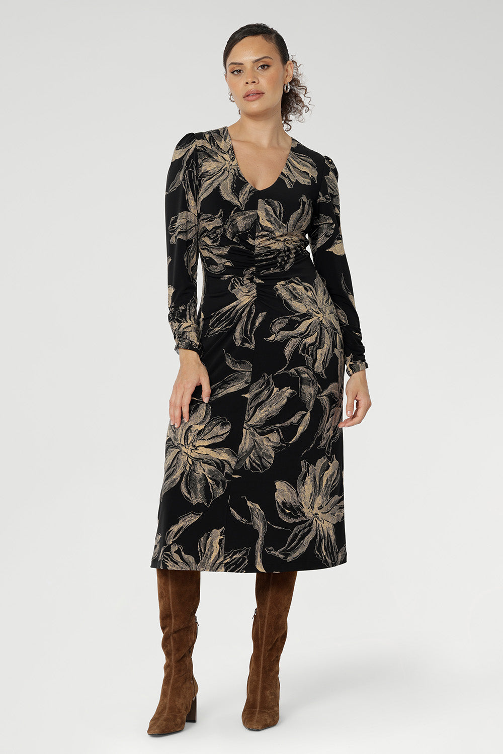 Designed to offer effortless elegance, this softly A-line silhouette features fashion-forward ruched sleeves and a deep, inky floral print in a rich coffee hue that captures the essence of the season.