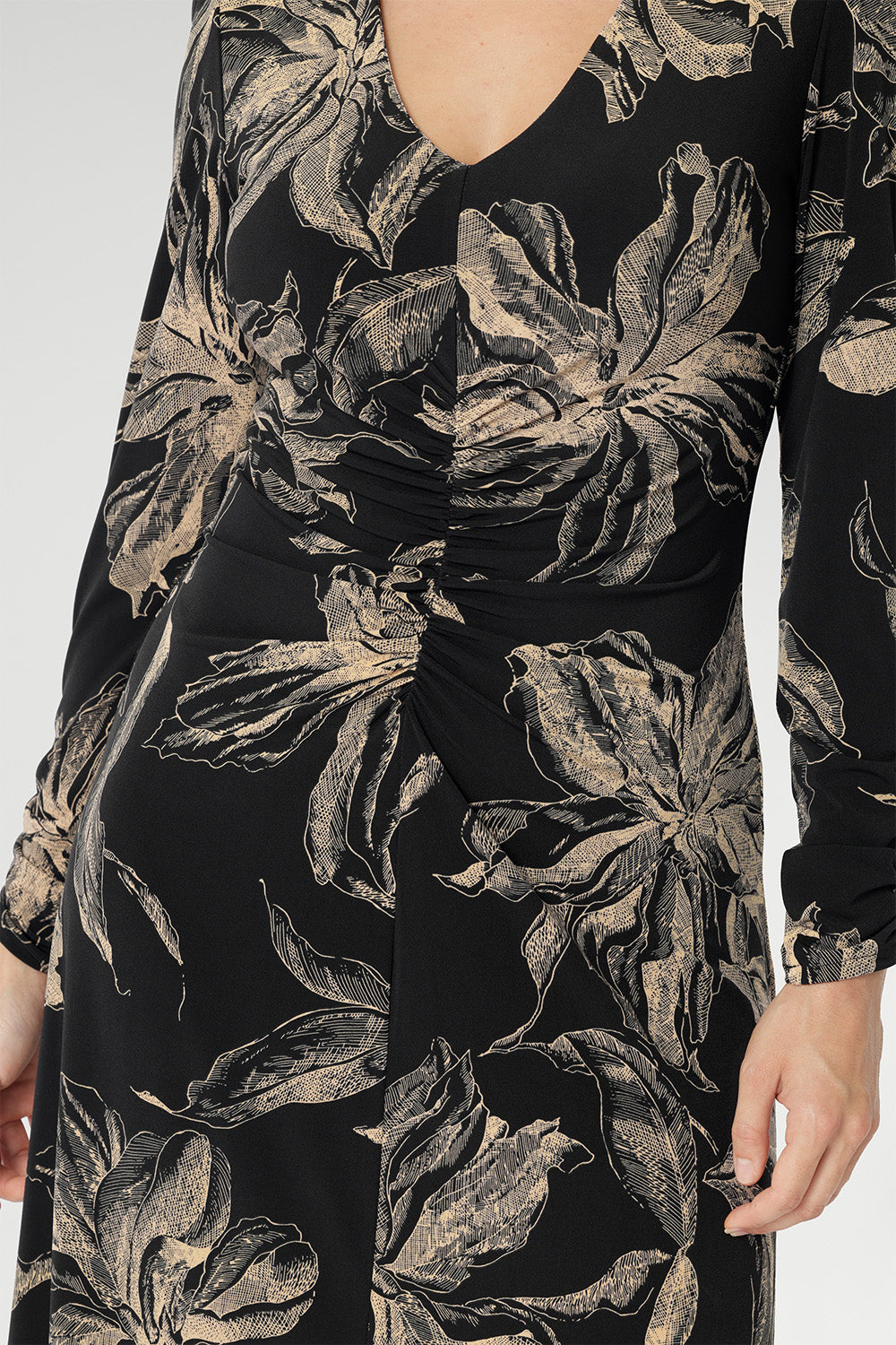 A-line silhouette features fashion-forward ruched sleeves and a deep, inky floral print in a rich coffee hue that captures the essence of the season. Available in sizes 8-24.