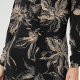 A-line silhouette features fashion-forward ruched sleeves and a deep, inky floral print in a rich coffee hue that captures the essence of the season. Available in sizes 8-24.