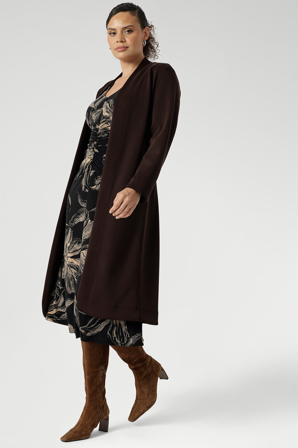 The Nadine Dress is a sophisticated wardrobe essential, designed and made in Australia from our signature black dry-touch stretch jersey. Featuring a deep, inky floral print in a rich coffee hue, this dress offers a modern take on timeless elegance. The soft A-line silhouette flatters the figure, while ruched sleeves add a contemporary edge.