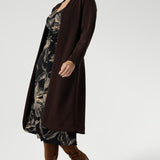 The Nadine Dress is a sophisticated wardrobe essential, designed and made in Australia from our signature black dry-touch stretch jersey. Featuring a deep, inky floral print in a rich coffee hue, this dress offers a modern take on timeless elegance. The soft A-line silhouette flatters the figure, while ruched sleeves add a contemporary edge.