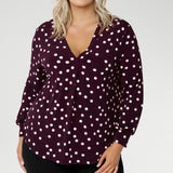 The Paeton Top in burgundy spot is a standout piece in our luxe separates collection, combining everyday comfort with elevated design. Crafted from a premium soft-touch jersey fabric with gentle stretch, this functional women’s top is designed for a relaxed fit—though you can size down for a more tailored silhouette.