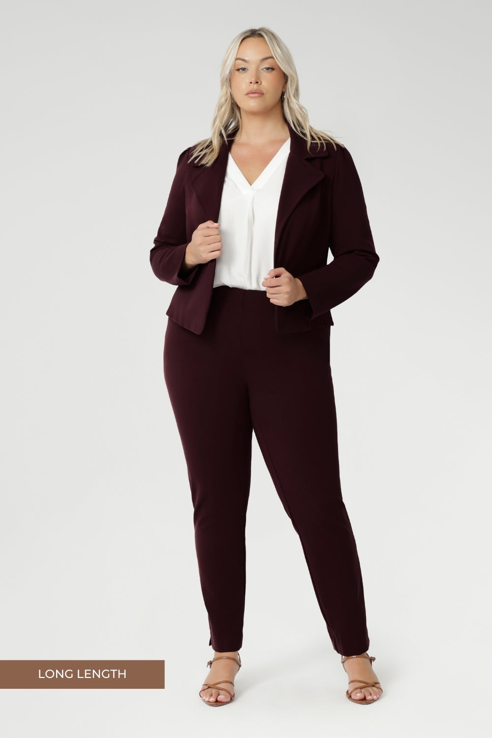 Plus size woman wears Burgundy Paxton Pant. Designed as a pull-on style pant, crafted from dry touch Ponte fabric that provides firm stretch and full body comfort. Size 18 model wears the Garcia Jacket in the matching burgundy colour for a coordinated suiting look.