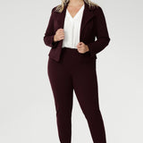 Plus size woman wears Burgundy Paxton Pant. Designed as a pull-on style pant, crafted from dry touch Ponte fabric that provides firm stretch and full body comfort. Size 18 model wears the Garcia Jacket in the matching burgundy colour for a coordinated suiting look.