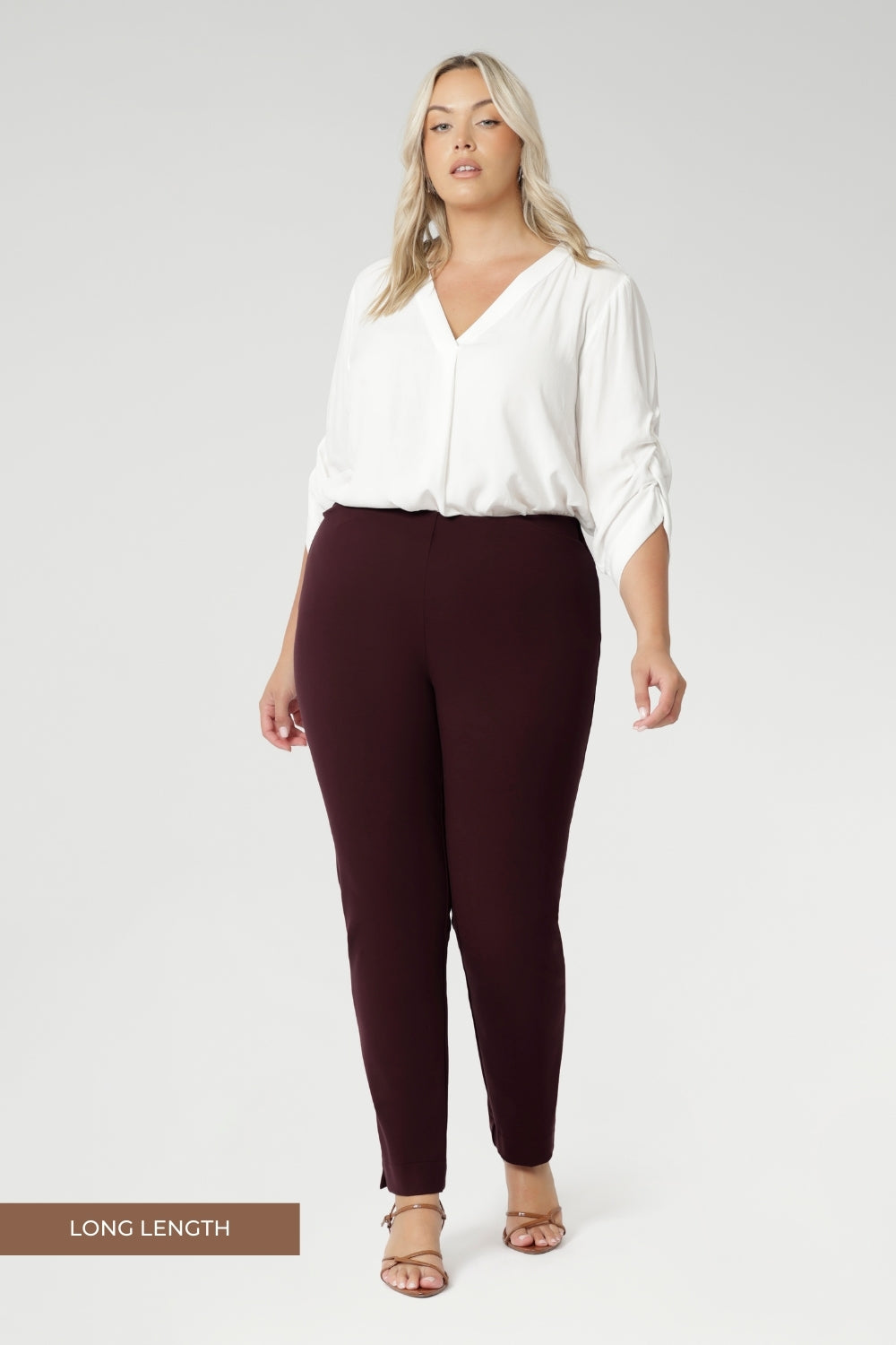 Plus size woman wears Burgundy Paxton Pant. Designed as a pull-on style pant, crafted from dry touch Ponte fabric that provides firm stretch and full body comfort. Size 18 model wears the Garcia Jacket in the matching burgundy colour for a coordinated suiting look.