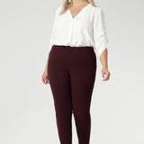 Plus size woman wears Burgundy Paxton Pant. Designed as a pull-on style pant, crafted from dry touch Ponte fabric that provides firm stretch and full body comfort. Size 18 model wears the Garcia Jacket in the matching burgundy colour for a coordinated suiting look.