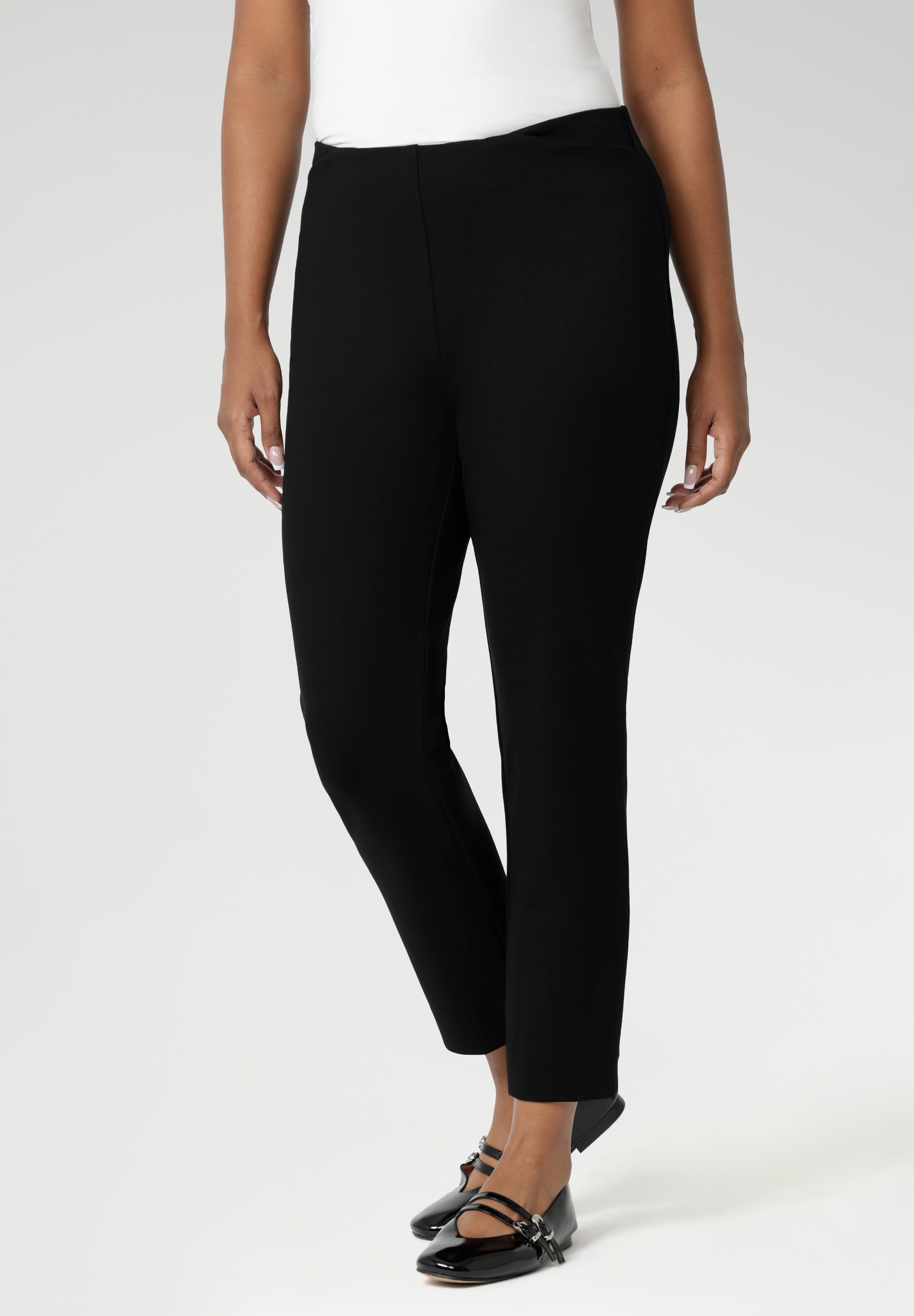 Close up of a size 10 woman wears the Paxton Pant in black. A loose fitting ponte pant in black. A slack pant with cropped length. Made in Australia for women size 8-24.