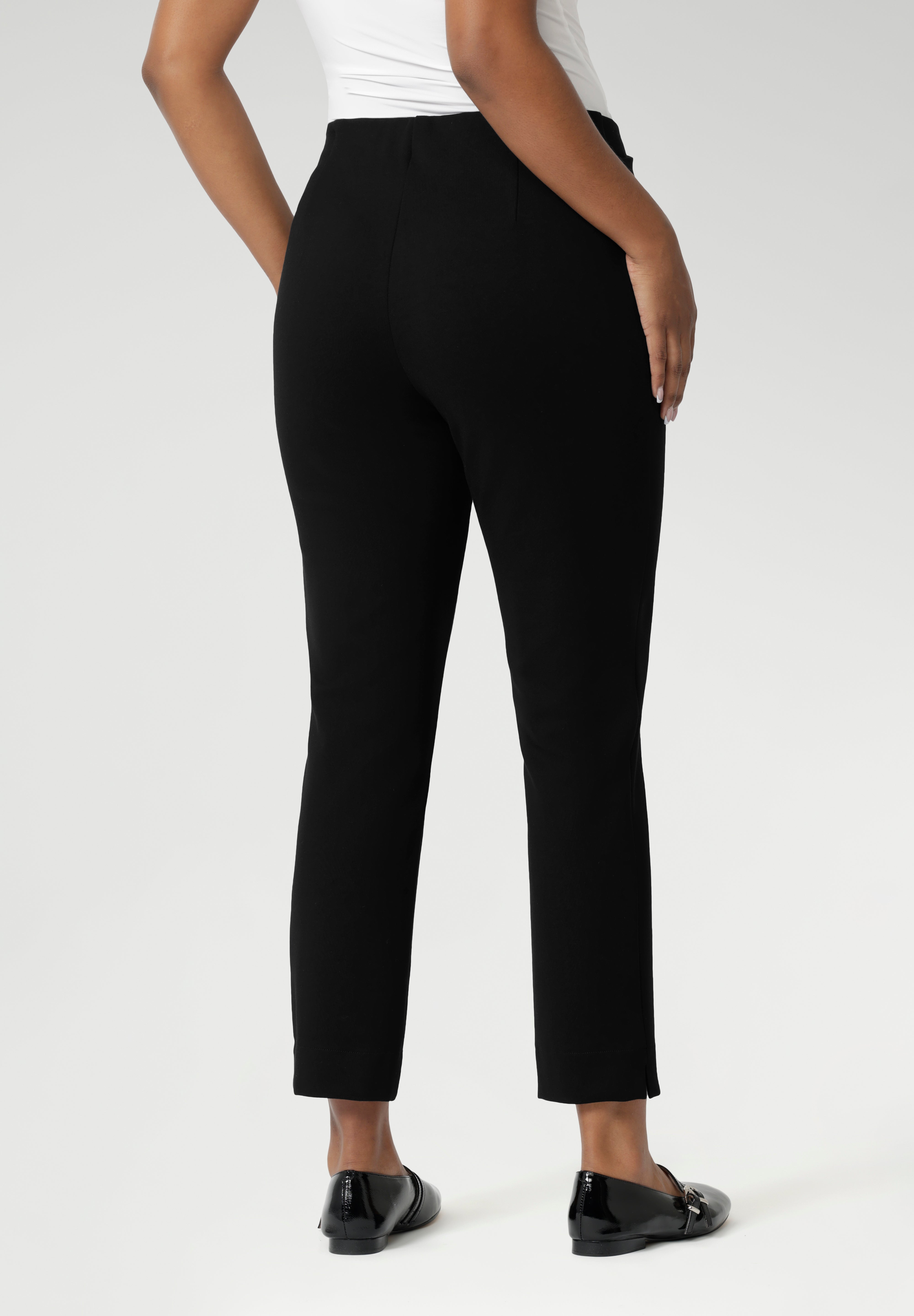 Close up of a size 10 woman wears the Paxton Pant in black. A loose fitting ponte pant in black. A slack pant with cropped length. Made in Australia for women size 8-24.