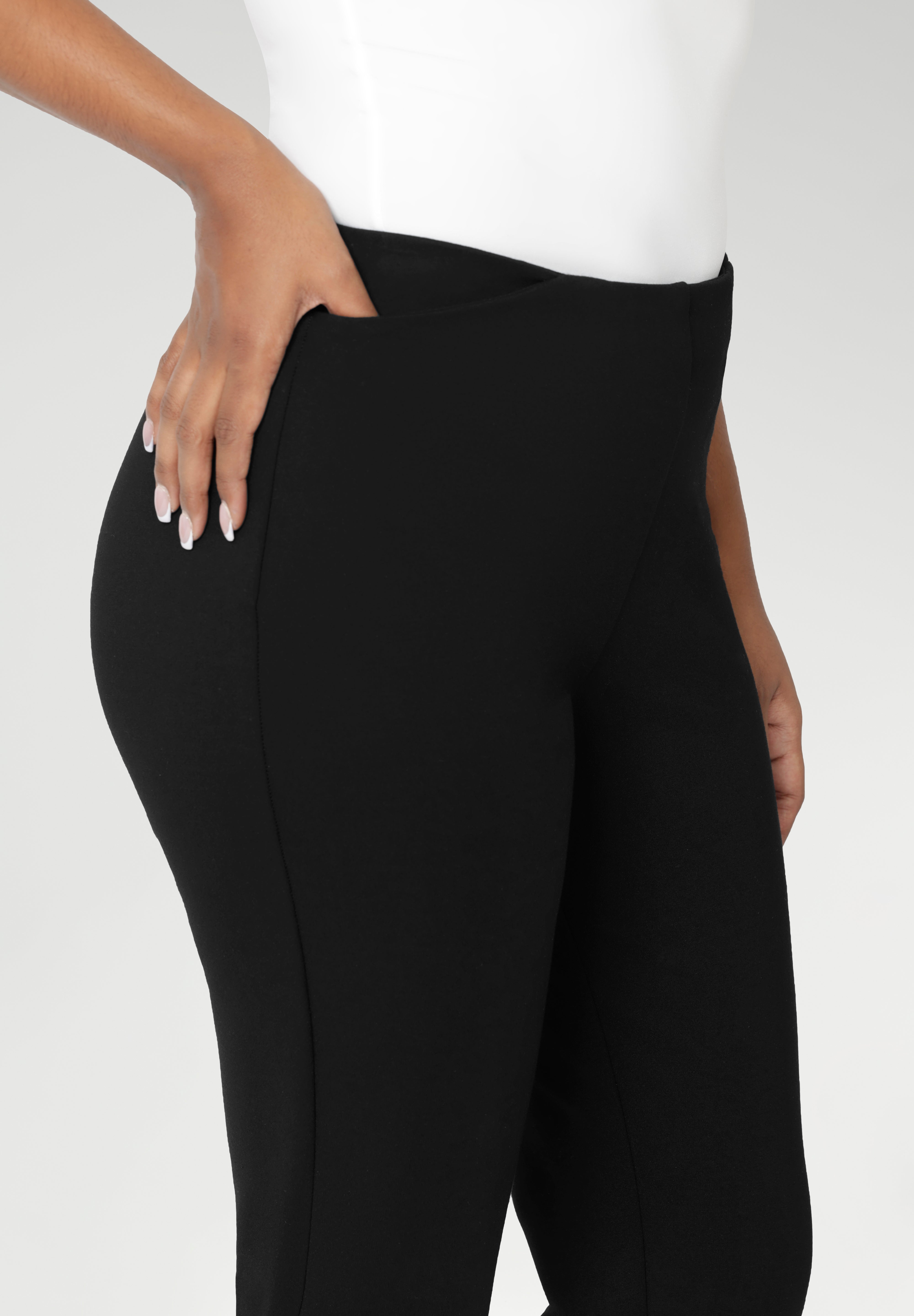 A size 10 woman wears the Paxton Pant in black. A firm fitting ponte pant in black. A slack pant with cropped length. Made in Australia for women size 8-24.
