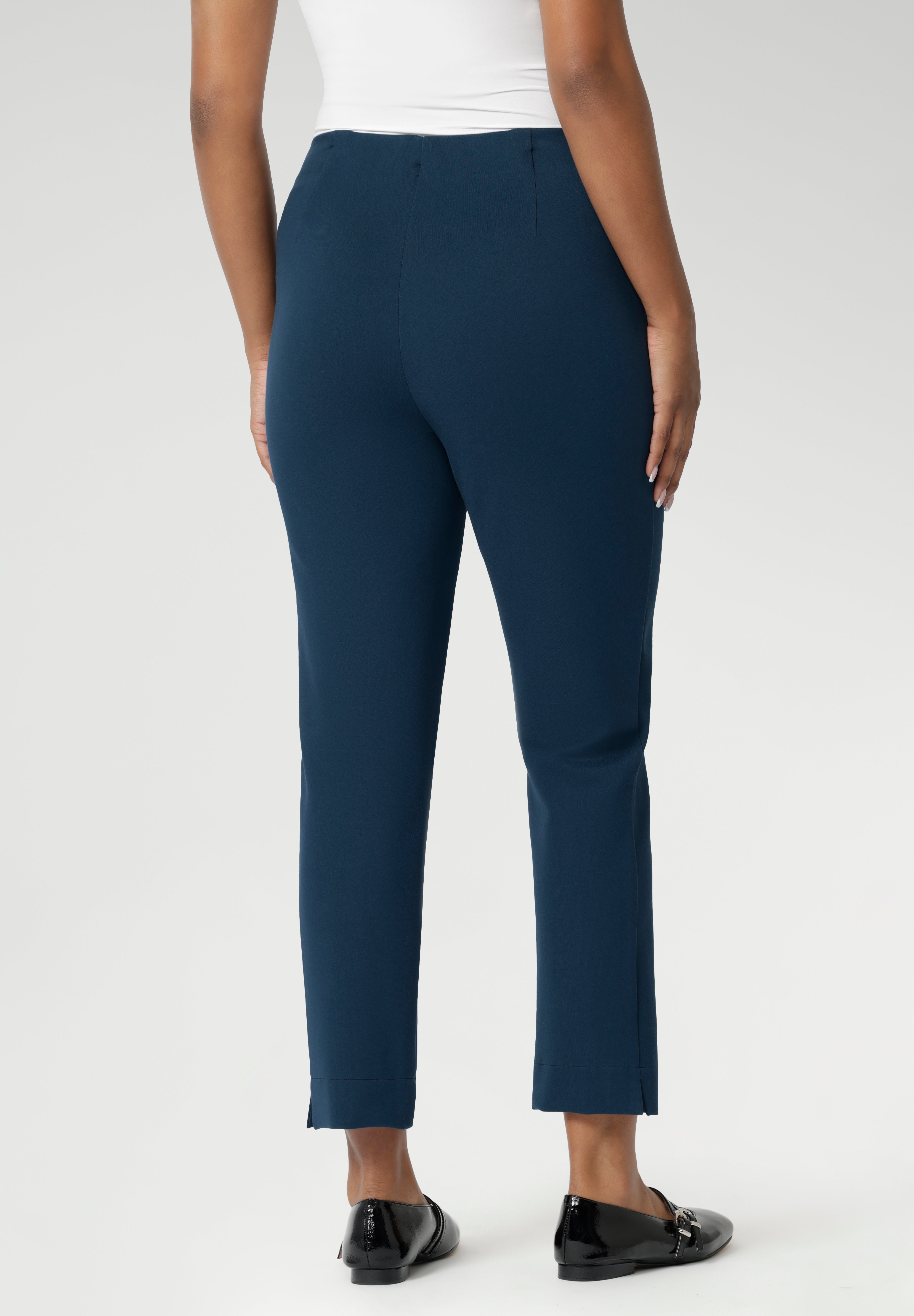 The Paxton Pant is on a dry-touch Ponte jersey base. The fabric has firm stretch. Pull on style pant features a straight leg cut, high pockets and ankle slit details. Available in 3 lengths in sizes 8-24.