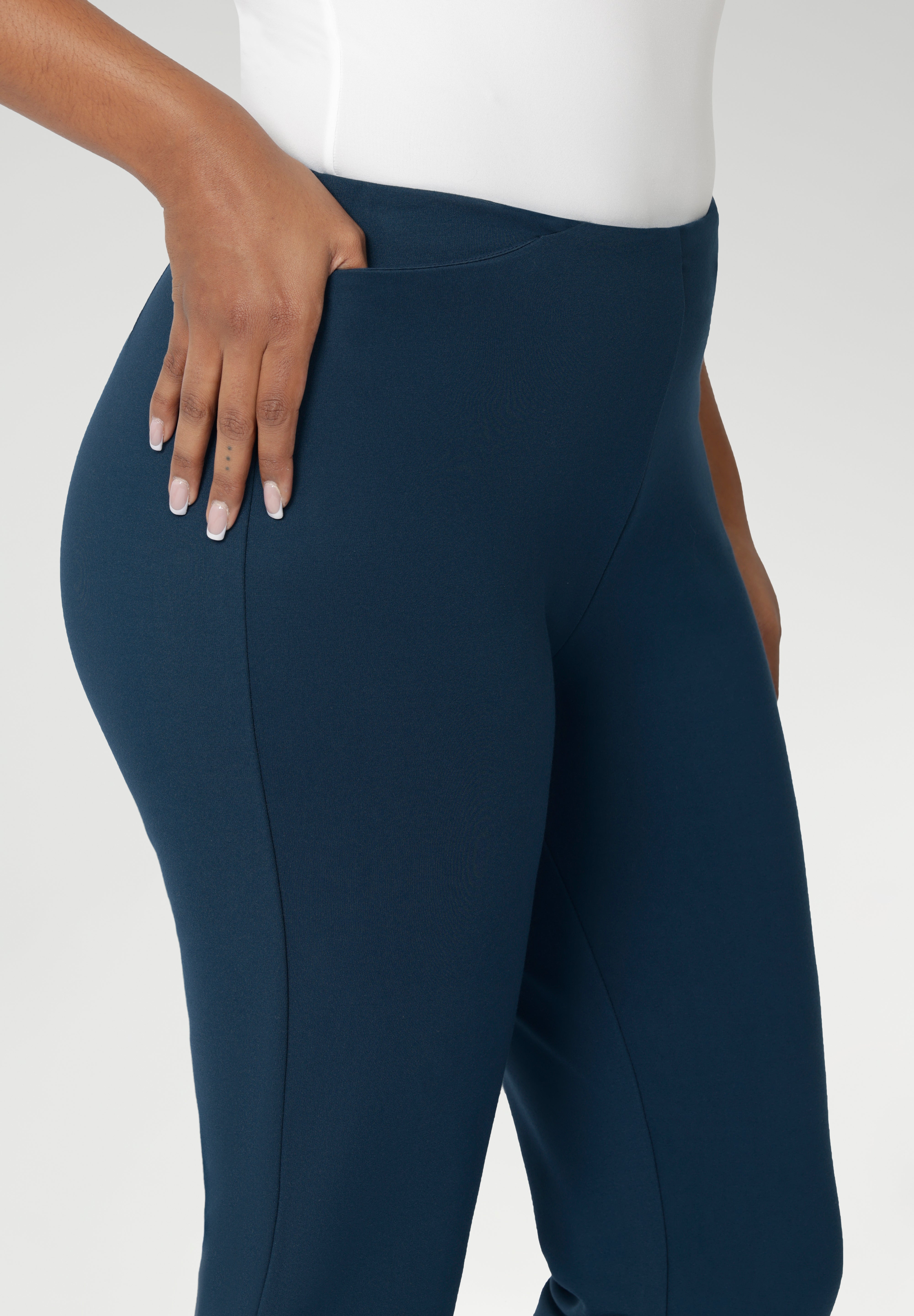 The Paxton Pant is on a dry-touch Ponte jersey base. The fabric has firm stretch. Pull on style pant features a straight leg cut, high pockets and ankle slit details. Available in 3 lengths in sizes 8-24.
