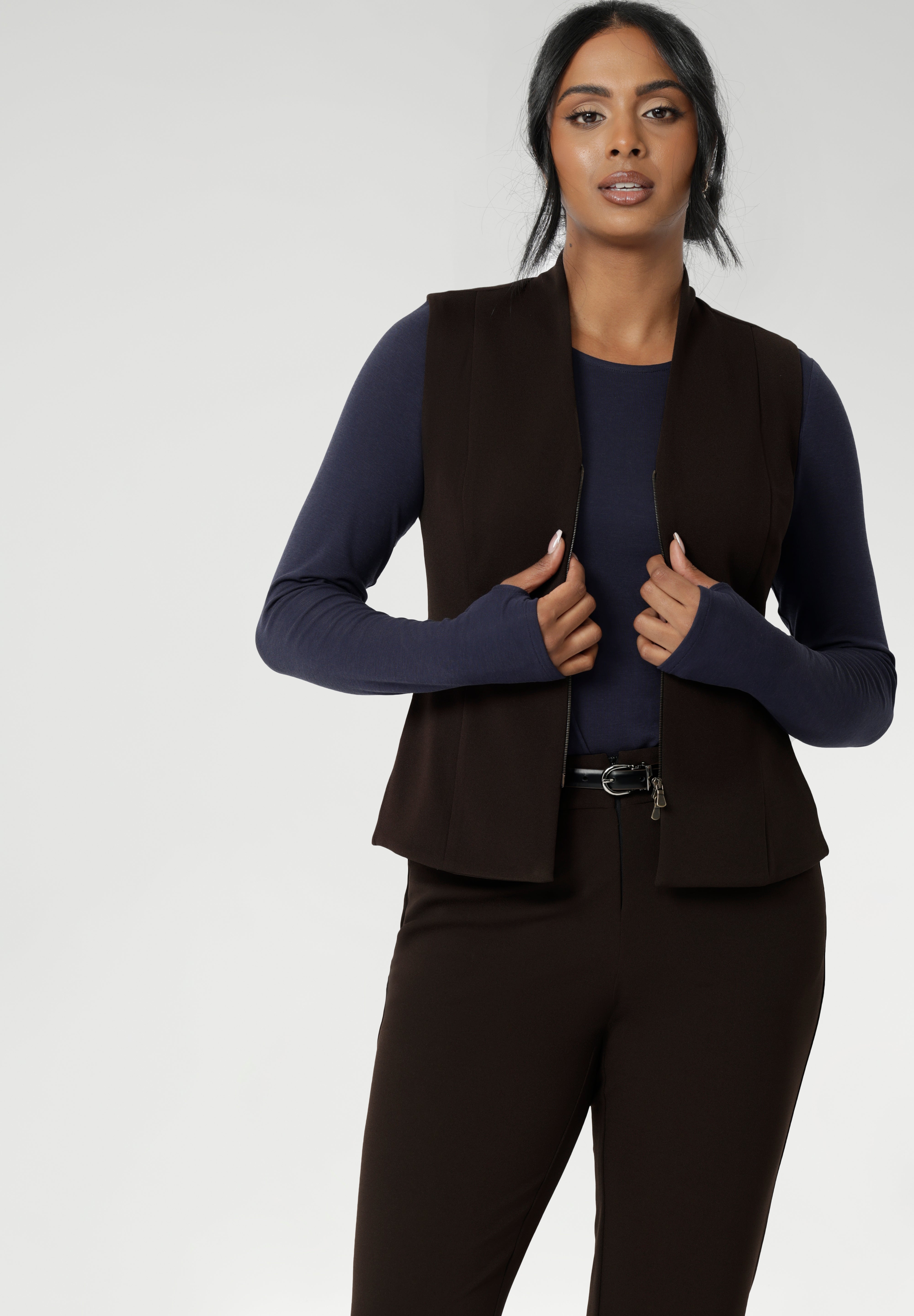 It also includes back side panels for a tailored fit and is available in sizes 8-24. Proudly made in Australia, this vest is a must-have for those seeking both style and comfort. Size 10 model wears double ended zip vest over tencel wool winter top.