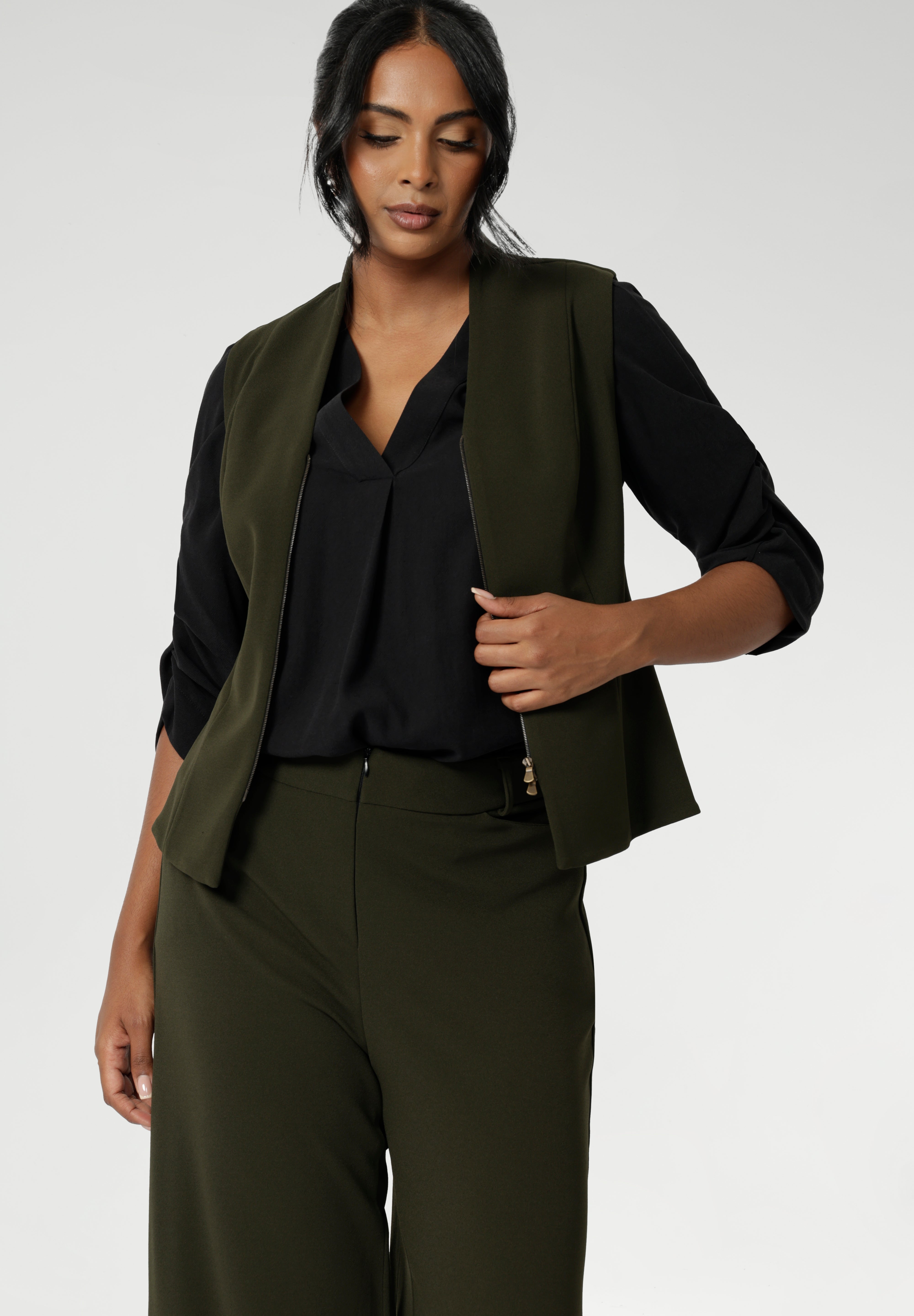 The Pennyworth Vest is crafted to offer endless styling options, thanks to its double-ended zip, allowing for versatile wear. Elevate your style with this chic and functional addition to your closet. Made from a luxurious Scuba Crepe Jersey fabric, it provides a soft, textured feel with comfortable stretch.