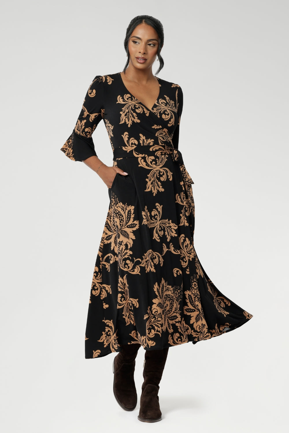 A beautifully crafted midi wrap dress that combines effortless elegance with everyday comfort. Falling just below the knee, this flattering A-line silhouette is designed in a soft, stretchy jersey fabric that moves with you.