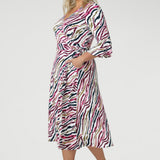 his versatile wrap dress features a functioning wrap style with waist ties for an adjustable fit. The double-layer back bodice provides added structure, while the 3/4 length fluted sleeves below the elbow bring a romantic, feminine flair.