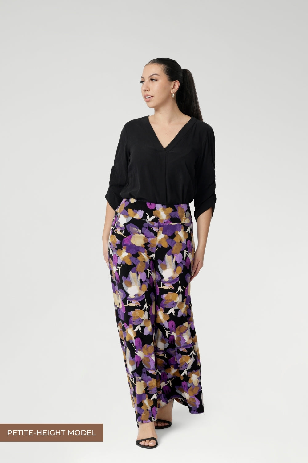 Petite height woman wears pull-on style pants with a supportive double-layer waistband, the Presley Pant offers a flattering fit with all-day comfort and a gorgeous pop of colour.