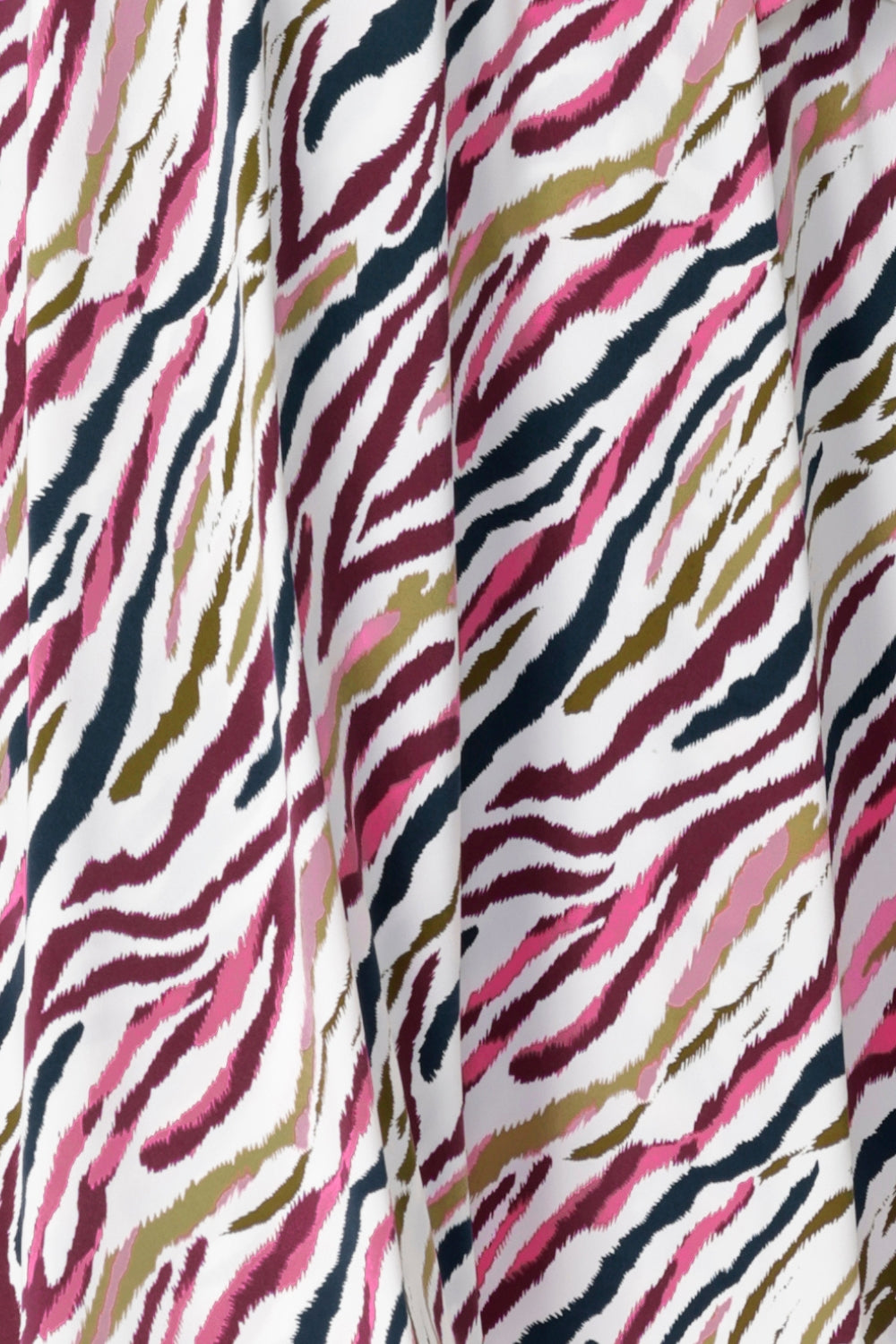 Close up image of Rainbow Zebra print used by Australian clothing brand Leina & Fleur to create a collection of workwear shirts and dresses. Crafted on Australia Made dry touch jersey fabric that has soft stretch and provides full body comfort.