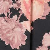 The Romantic Floral print blooms across a black satin base, with delicate pink tones adding depth and softness to the look. Crafted by Leina & Fleur to create a collection of women's tailored blouses. Romantic Floral is a beautifully feminine and elevated wardrobe essential, perfect for both work and occasion dressing.