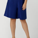 Close up of a size 12 women wearing the Houston Blazer in Cobalt linen size 12. Styled back with a matching Cobalt Linen Blazer with a button front and patch pockets. Made in Australia for women size 8 to 24.
