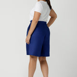 Back view of women wearing the Houston Blazer in Cobalt linen size 12. Styled back with a matching Cobalt Linen Blazer with a button front and patch pockets. Made in Australia for women size 8 to 24.