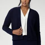 Size 10 woman wears navy jacket/ cardigan. Featuring long sleeves, this jacket-cardigan hybrid is the perfect trans-seasonal cover up for women. Move into the cooler months in style, with this comfortable jacket for workwear and casual layering. Available in sizes 8-24.