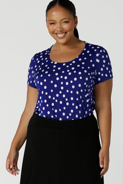Size 16 curvy woman wears a scoop neckline top on a polka dot print with a cobalt base. Made in Australia for women size 8 to 24.