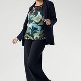 A striking abstract print in green, blue, and plum tones brings a touch of bold personality, while the straight hem makes styling simple whether worn loose or tucked in. Size 10 model wears the relaxed fit tee with navy blazer and black sandals.
