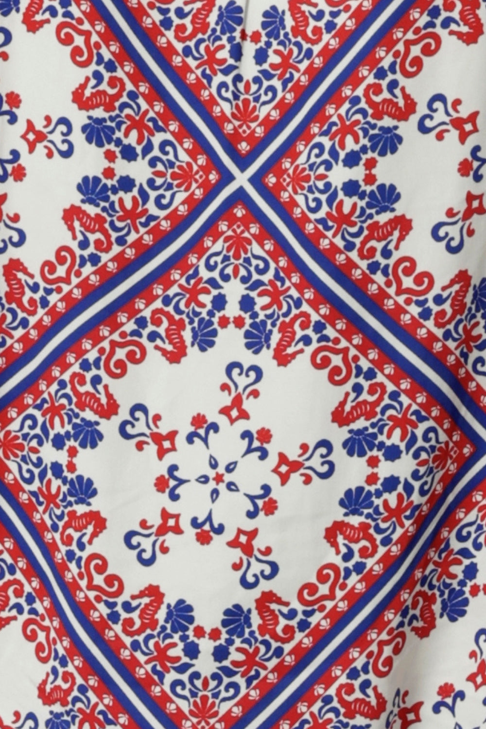 The Seahorse print is on a white Rayon Satin base with print details in blue and red. The fabric has a soft lustre and no stretch. The fabric has been used by clothing brand Lina & Fleur to create a summer collection of tops & pants