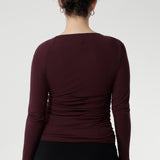 Simmi Top in Wine offers a bold yet elegant statement. Crafted from a luxurious heavy-weight Lyocell Knit, this top is designed to flatter with its asymmetrical neckline and subtle ruching at the shoulder and sides, creating a soft, sculpted shape.