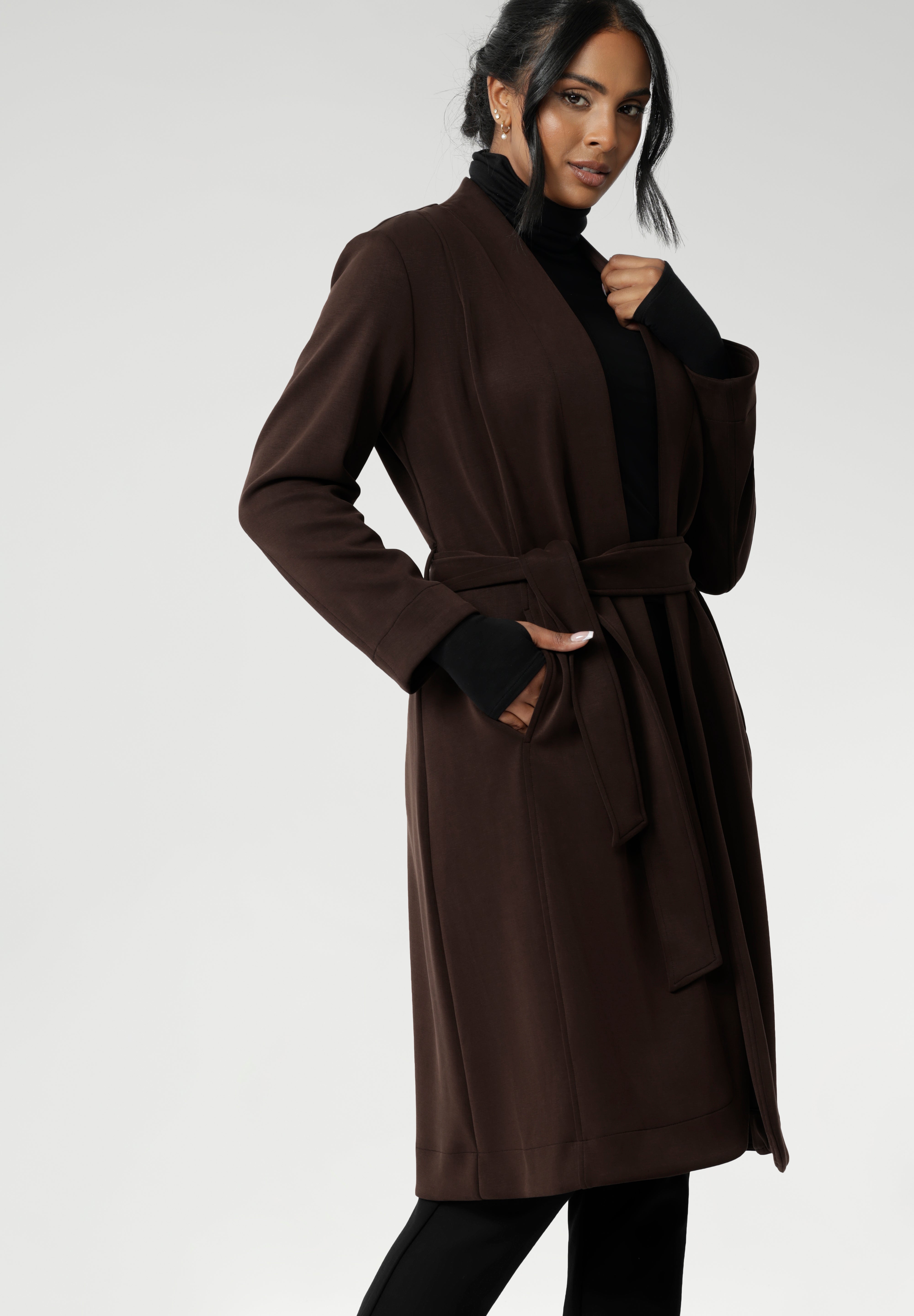 Elevate your wardrobe with the Sorel Trench Coat — a timeless, Australian-made essential designed for modern sophistication. Crafted from our premium Modal fabric, this trench delivers a luxurious feel with a soft, fluid drape and just the right amount of stretch for all-day comfort.