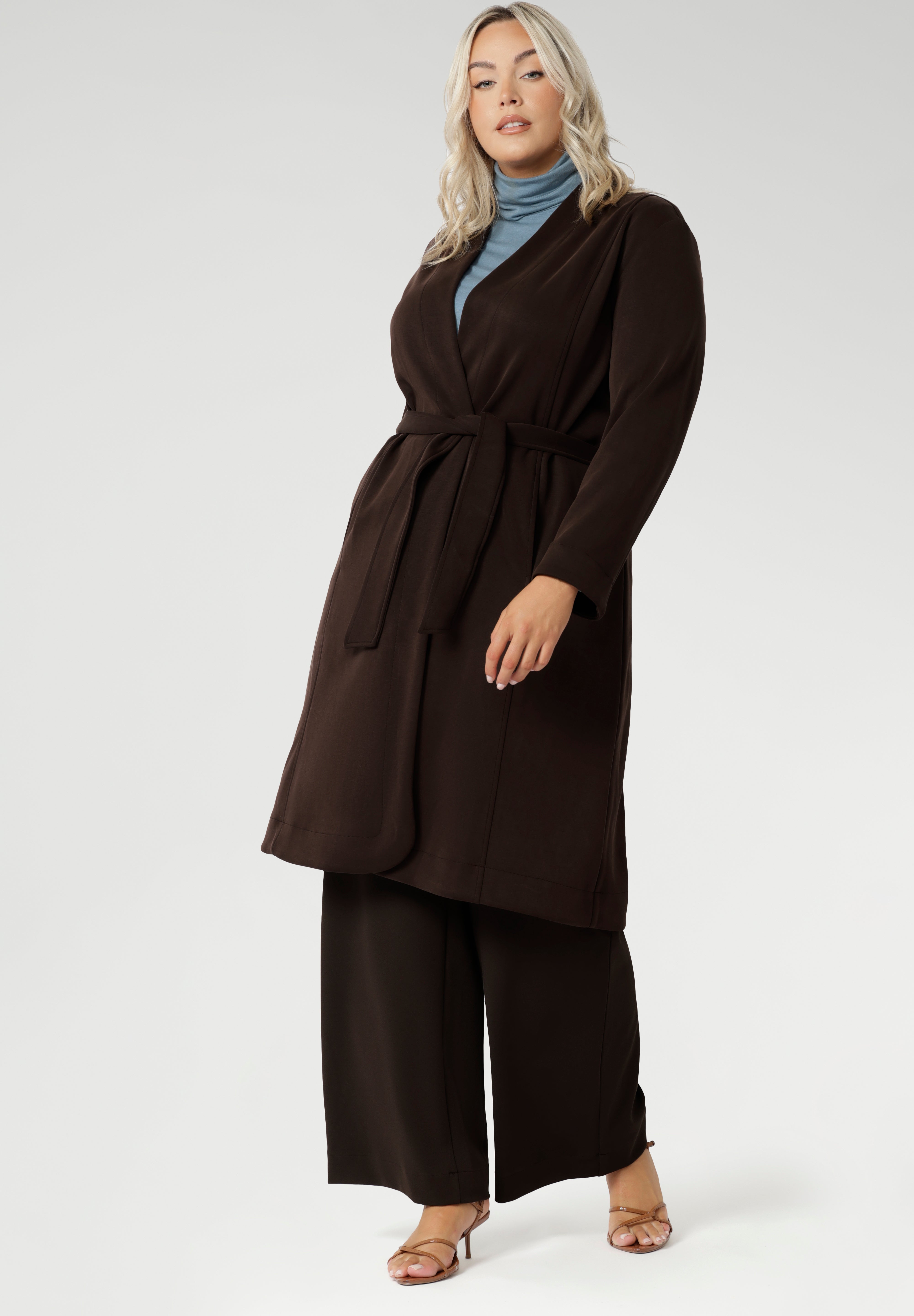 Elevate your wardrobe with the Sorel Trench Coat — a timeless, Australian-made essential designed for modern sophistication. Crafted from our premium Modal fabric, this trench delivers a luxurious feel with a soft, fluid drape and just the right amount of stretch for all-day comfort.