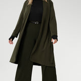 The Sorel Trench Coat is expertly tailored with a modern, sophisticated silhouette that elevates any wardrobe. Crafted from a luxurious winter-weight Modal fabric, it combines soft structure and stretch, making it the perfect travel companion for those seeking both style and comfort.