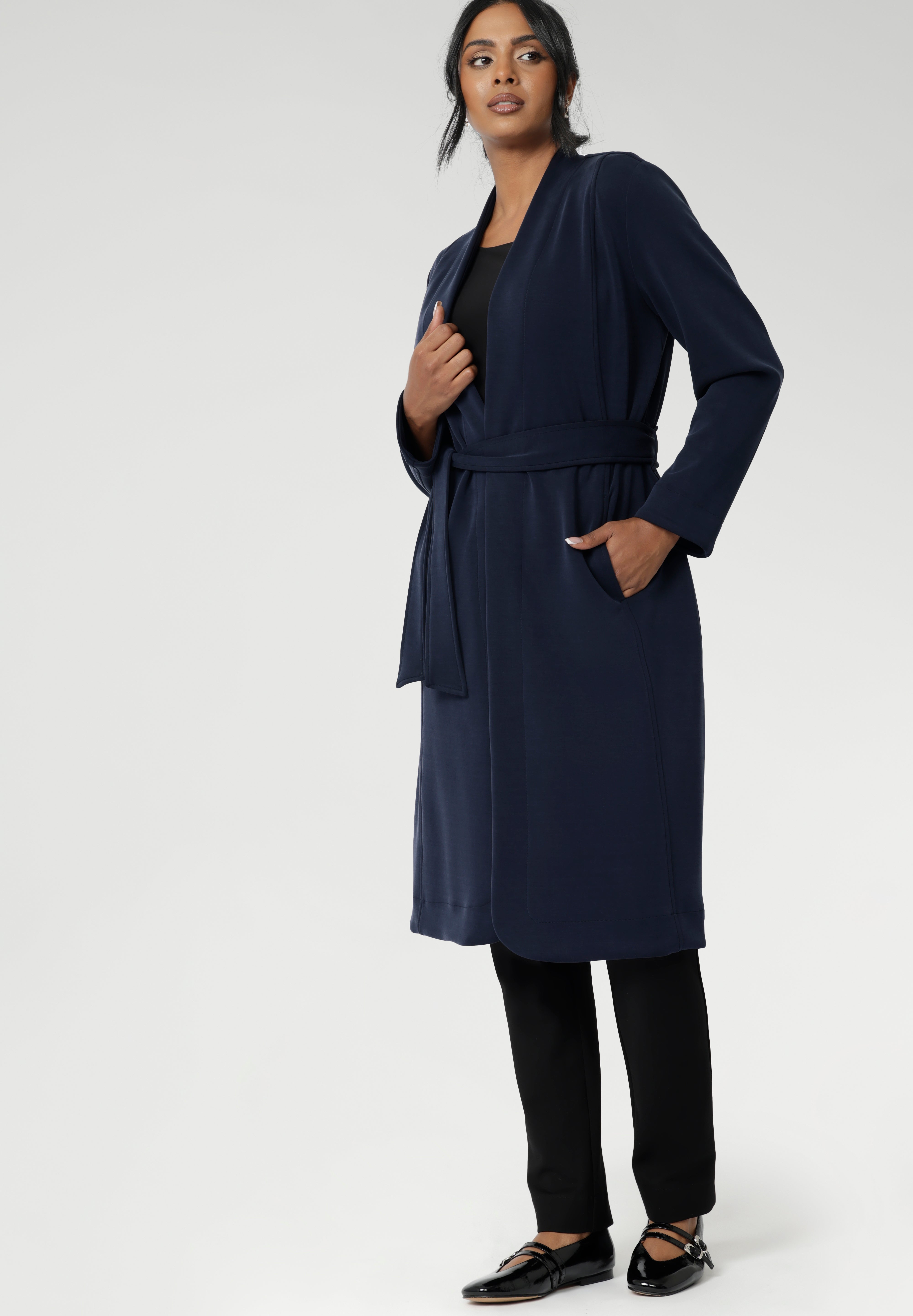 The buggy lining at the back ensures added comfort, while the waist seam at the back provides a flattering shape. With belt loops and a fabric waist tie, this versatile trench coat is available in sizes 8-24 and is proudly made in Australia.