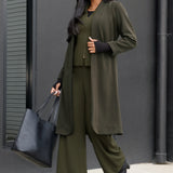The Sorel Trench Coat is expertly tailored with a modern, sophisticated silhouette that elevates any wardrobe. Size 10 model wears winter Trenchcoat in Dark Olive over a olive coloured suiting, creating an elevated workwear look.