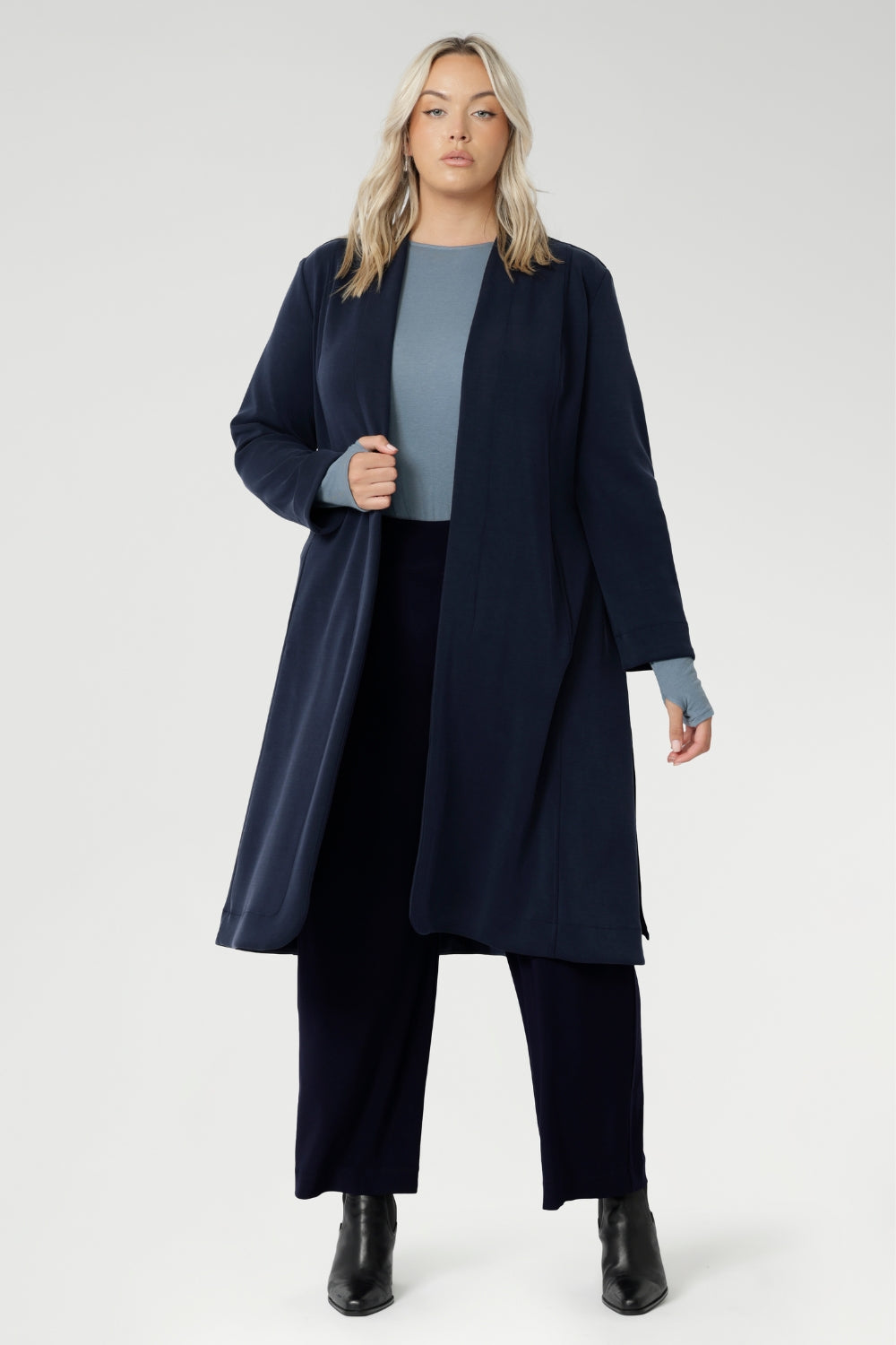The Sorel Trench Coat is expertly tailored with a modern, sophisticated silhouette that elevates any wardrobe. Crafted from a luxurious winter-weight Modal fabric, it combines soft structure and stretch, making it the perfect travel companion for those seeking both style and comfort.